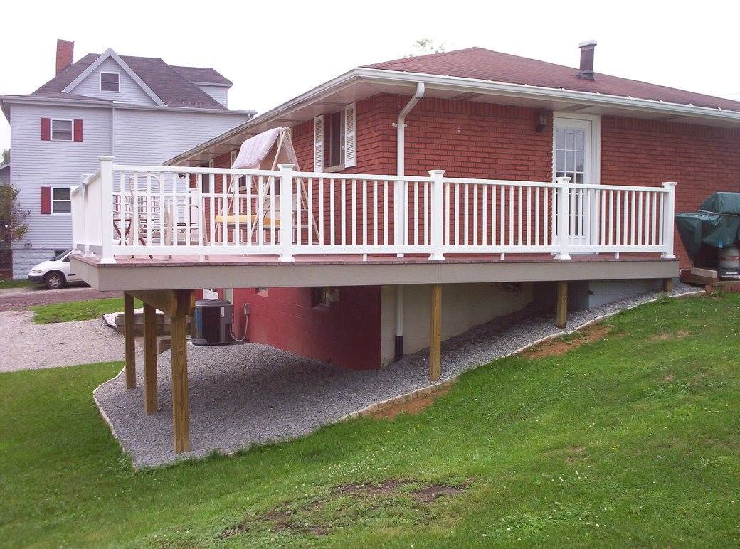 New elevated deck on a brick ranch home